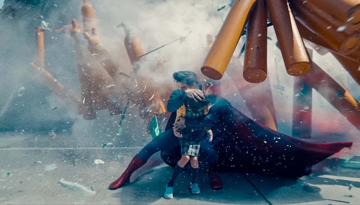 Superman saving a little girl in the Superman trailer